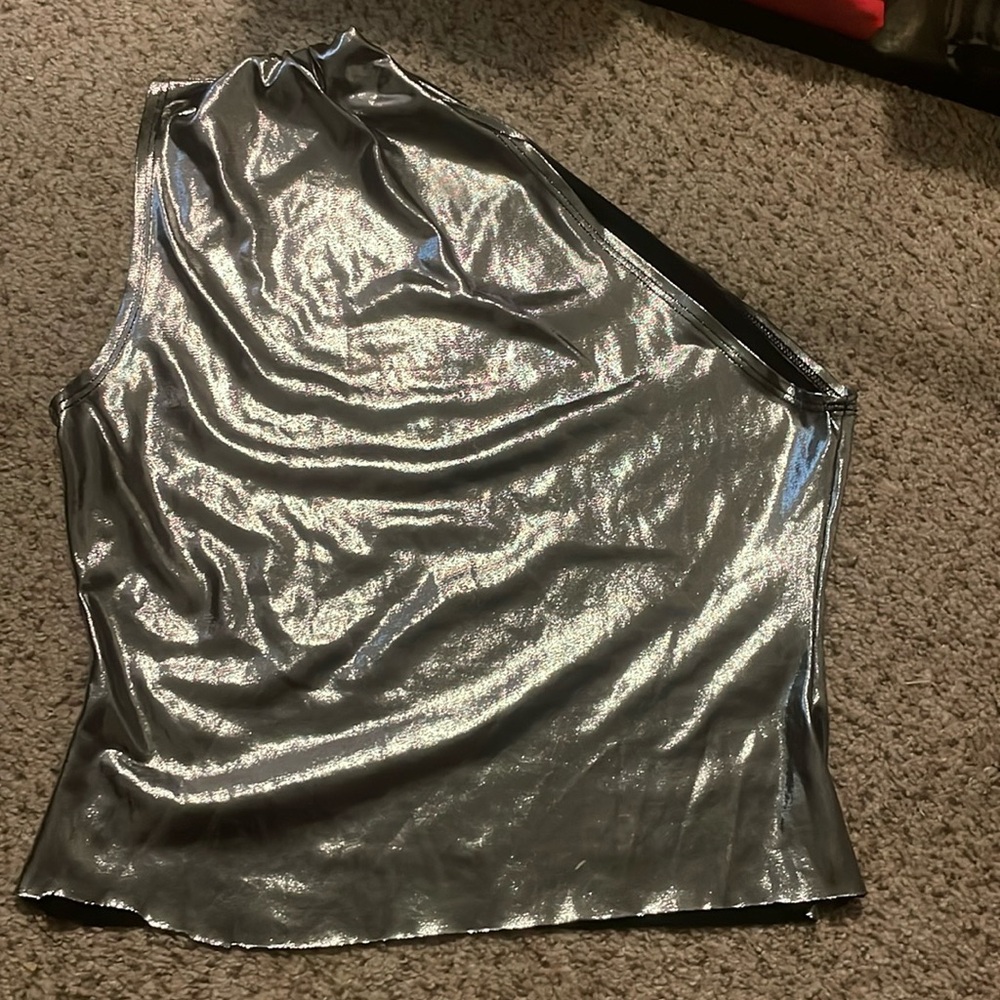 Silver shiny one shoulder going out top.